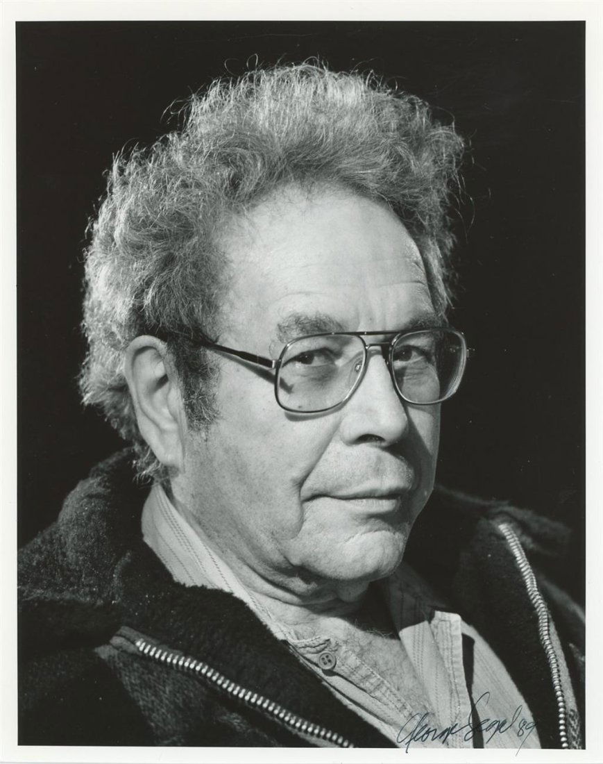 George Segal- Signed Photograph: 8x10 B&W glossy finish photograph signed "George Segal 89" in black felt tip ink. In very good condition. (1934-2021) George Segal was an American actor. He became popular in the 1960s and 1970s for p
