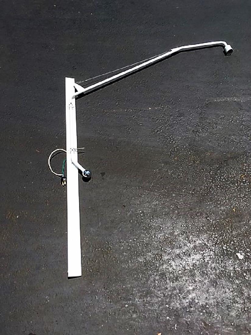 Extra Large Swing Arm Sconce: Extra Large Swing Arm Sconce for over a bed or in a restaurant. Showroom sample. White powder coat finish. Approximte sizes, 42 inch back plate and 60 inch reach.