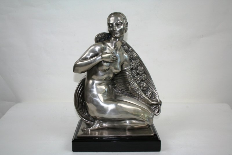 Art Deco Bronze of a Nude Girl with Cape: Art Deco bronze of a nude girl with a flower cape. Bronze with silver patina on a heavy black marble base. In the style of Joe Descombs and marked in the base. foundry stamp. Paris. 20"H