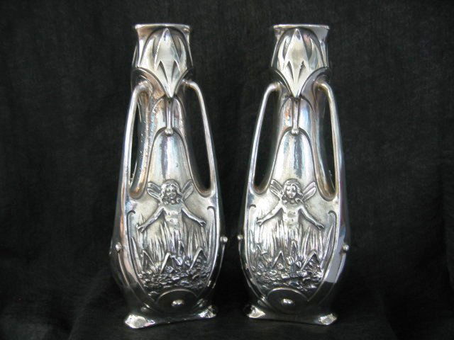 Pair of Antique Art Nouveau Vases: A pair of silver plated Antique Art Nouveau Vases. Signed J. Garnier. Circa 1890's. Glass liners missing. 16"H.