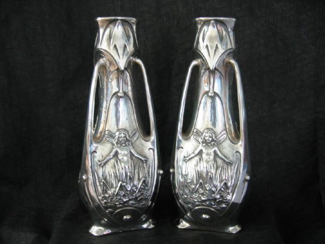 Pair of Antique Art Nouveau Vases: A pair of silver plated Antique Art Nouveau Vases. Signed J. Garnier. Circa 1890's. Glass liners missing. 16"H.