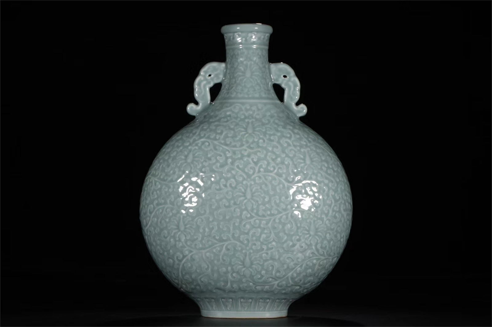 A Chinese Celadon Glazed Carved Porcelain Flask (1 of 9)