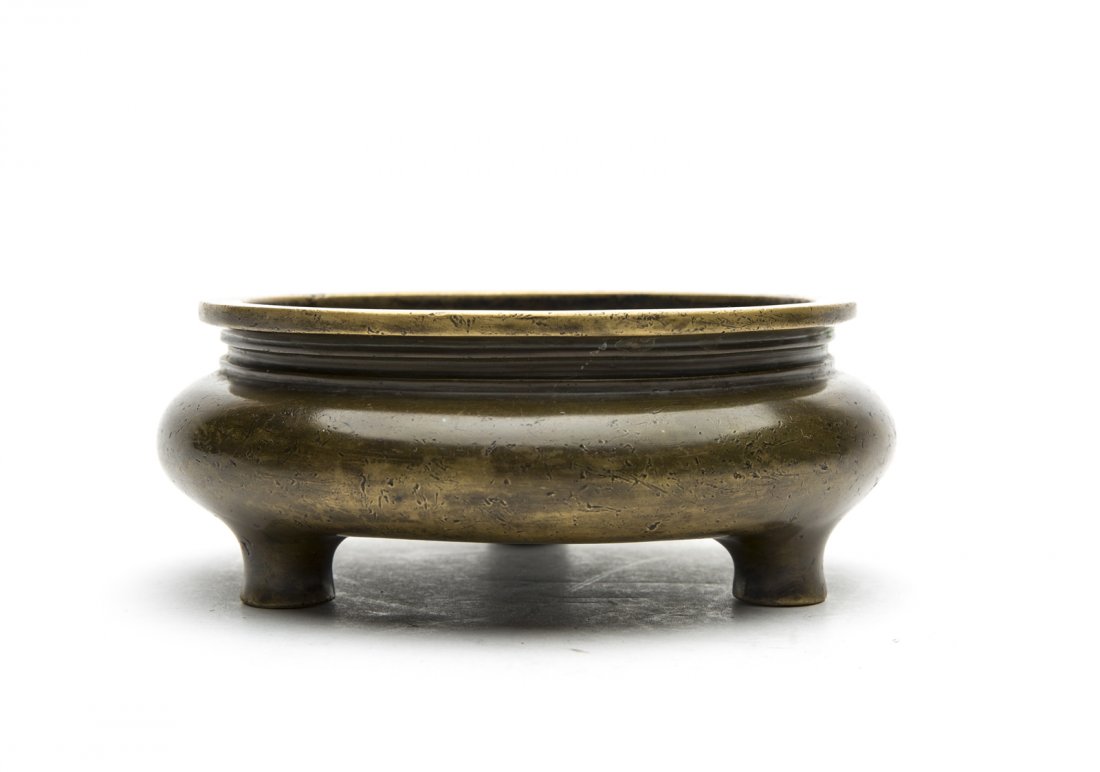 A CHINESE BRONZE TRIPOD CENSER (1 of 3)