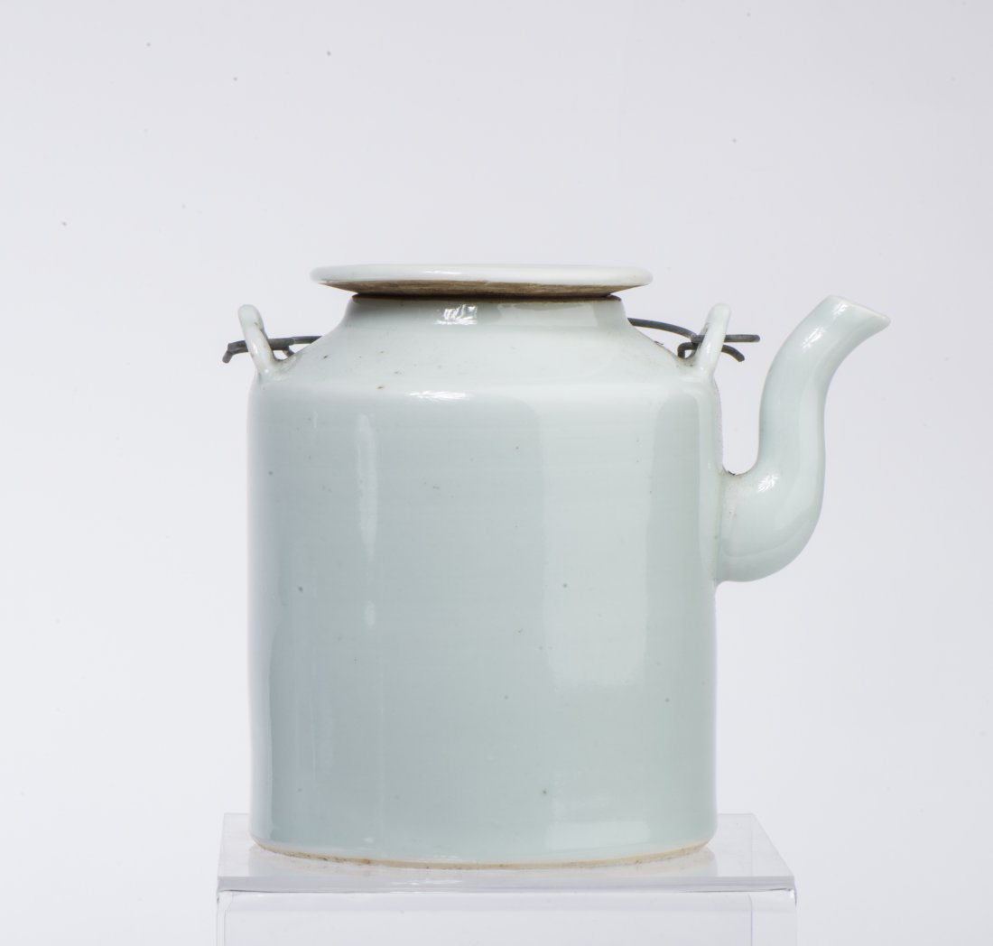 A WHITE GLAZED TEAPOT: A White Glazed Teapot overall ht. 5 1/4 in.