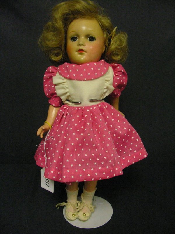 SUZANNE EFFANBEE COMPOSITION: SUZANNE EFFANBEE COMPOSITION Composition body, crack in back of head left lower neck to cheek, crazing to arms, legs and body, Back marked Suzanne Effanbee, made in USA, Circa 1940's Size: 14 inches,