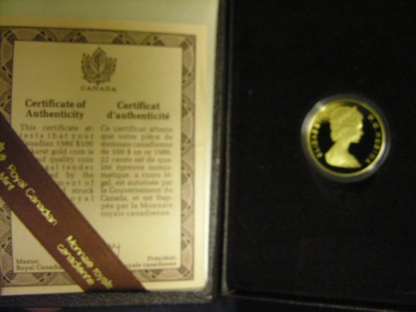 1986 CANADA GOLD 100 DOLLAR COIN: 1986 CANADA GOLD 100 DOLLAR COIN .917 gold; .5000 oz. AGW