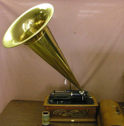 EDISON MODEL C CYLINDER RECORD PLAYER: EDISON MODEL C CYLINDER RECORD PLAYER Plays, has a few dents and dings to the brass horn. The wood case is in very nice condition.