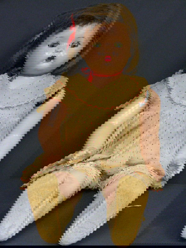 EARLY EFFANBEE COMPOSITION DOLL: EARLY EFFANBEE COMPOSITION DOLL Sleep eyes and painted features and has a wig. Jointed, the left arm is lose. Repaired with eyelet screw. Dress has some stains.
