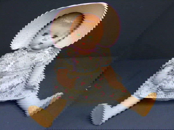 19IN PATSY ANN EFFANBEE DOLL: 19IN PATSY ANN EFFANBEE DOLL All composition, brown molded hair, green sleep eyes with lashes, good condition, closed mouth, Costume: original blue diamond and pink roses dress with original shoes, st