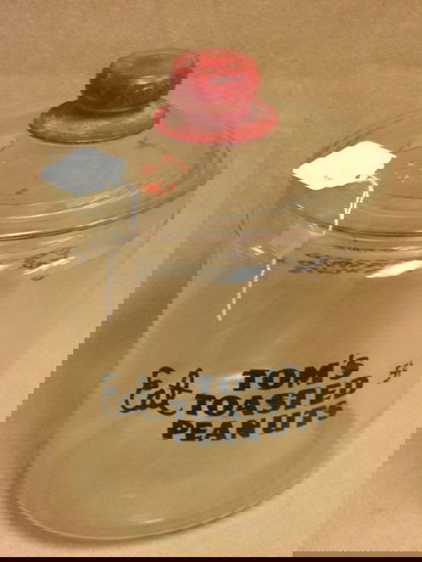 TOMS ORIGINAL 5 CENT PEANUT STORE JAR: TOMS ORIGINAL 5 CENT PEANUT STORE JAR Tom's original 5 cent peanut store jar, Chips in glass to outside top lip of jar, See photos,