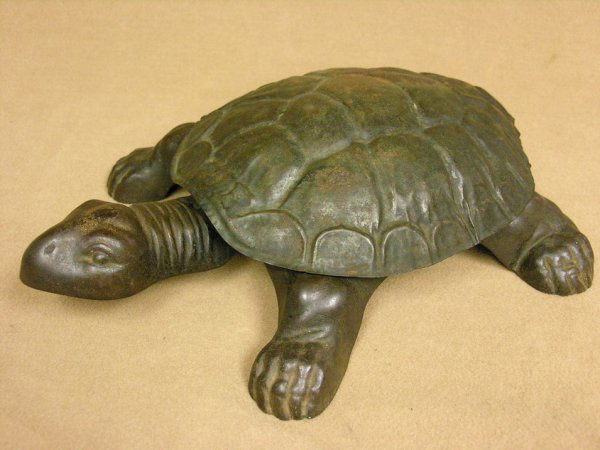 SALOON/BARBER SHOP TURTLE SPITTOON: SALOON/BARBER SHOP TURTLE SPITTOON Found in bars, barber shops, and country stores, Step on the head and spittoon opens for use, Cast iron base with pressed tin shell top, Signed: Golden Novelty Co. C