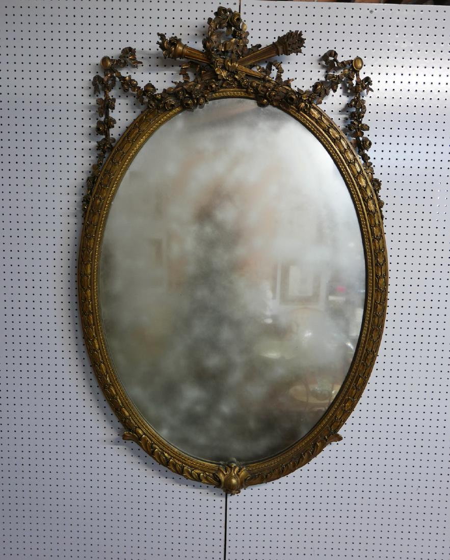 LARGE GILT OVAL MIRROR: LARGE GILT OVAL MIRROR 64"H 42"W