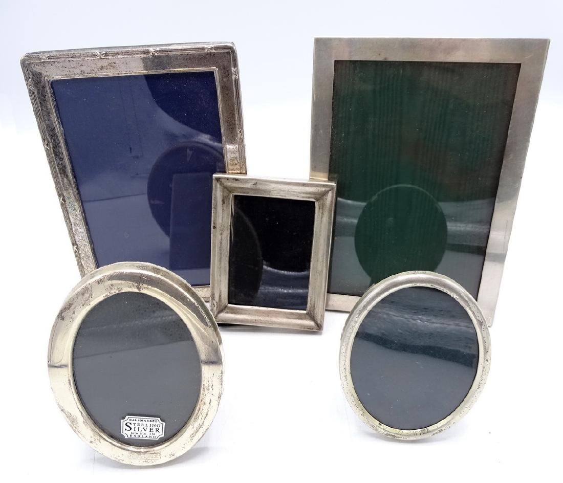 5 STERLING SILVER PICTURE FRAMES: 5 STERLING SILVER PICTURE FRAMES (COLLECTION E. LIFSHITZ)2 LARGEST FRAMES ONE MARKED WEBB; 5X7" SMALLER RECTANGULAR FRAME MKD MEXICO WITH ILL FITTING VELVET BACK 4X3"2 OVAL FRAMES; BOTH HALLMARKED 4X3