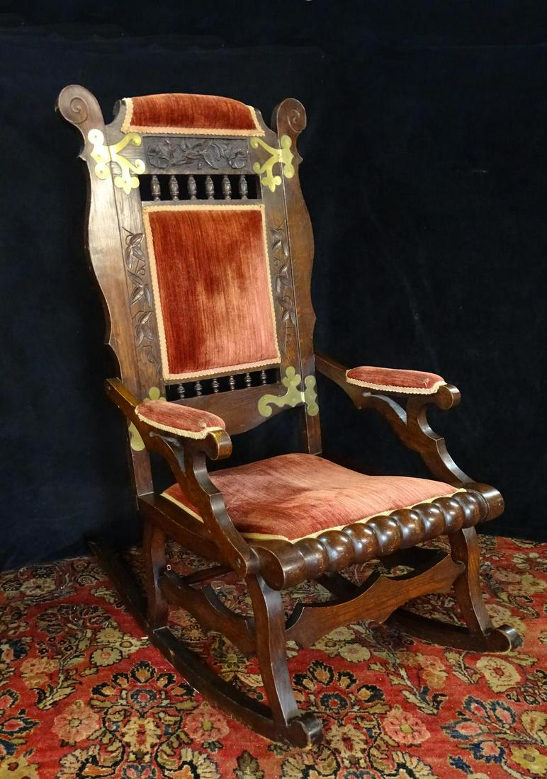 VICTORIAN WALNUT ROCKER: VICTORIAN WALNUT ROCKER UPHOLSTERED WITH BRASS TRIM 45"H 23"W 30"D