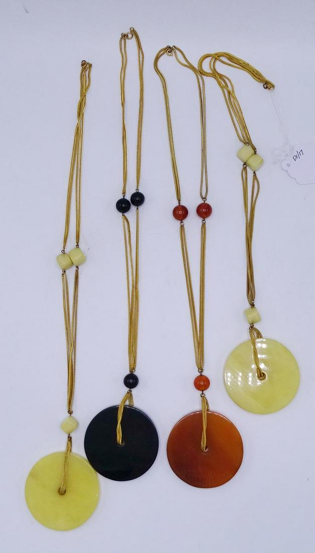 GROUP 4 NECKLACES WITH LARGE BAKELITE MEDALLIONS: GROUP 4 NECKLACES WITH LARGE BAKELITE MEDALLIONS (GEOFFREY BEENE FOUNDATION)