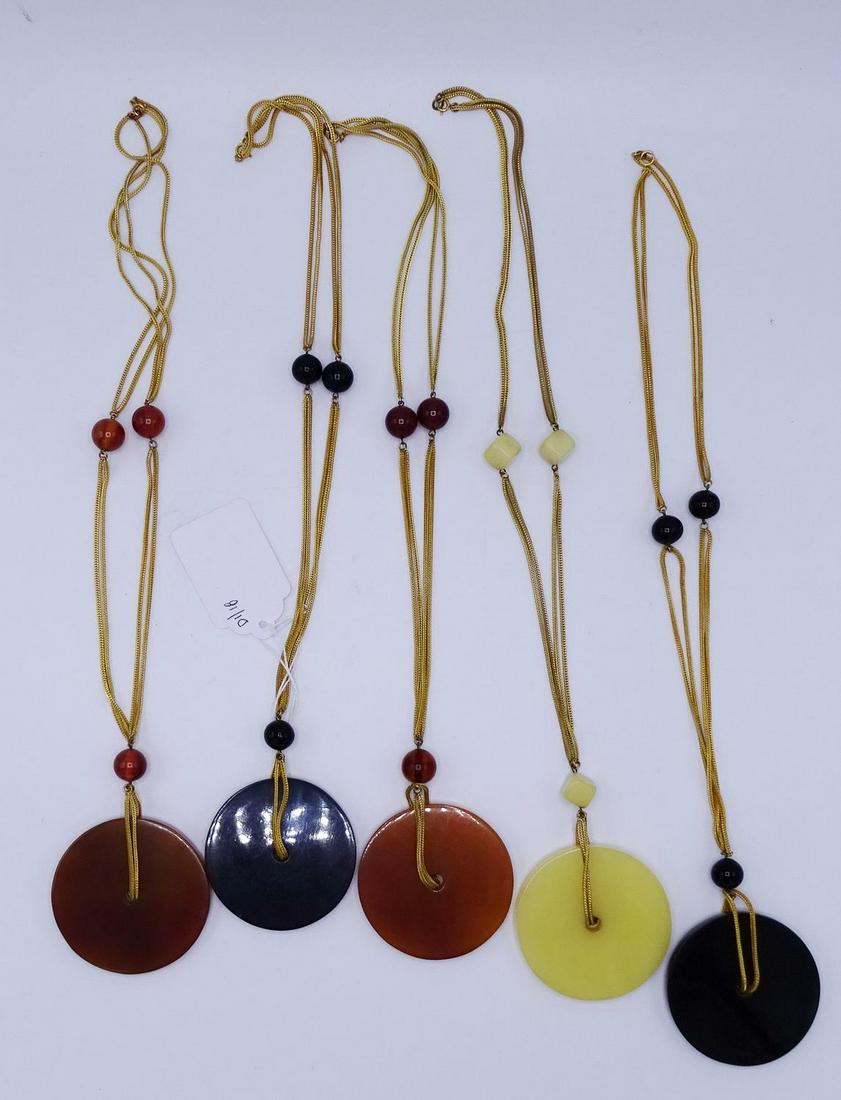 GROUP 5 NECKLACES WITH LARGE BAKELITE MEDALLIONS: GROUP 5 NECKLACES WITH LARGE BAKELITE MEDALLIONS (GEOFFREY BEENE FOUNDATION)