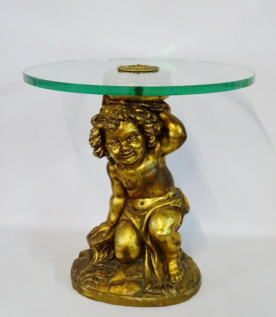 PUTTI FIGURAL GILT GLASS TOP ITALIAN TABLE 22.5"H: PUTTI FIGURAL GILT GLASS TOP ITALIAN TABLE 22.5"H 21.75"DIA..