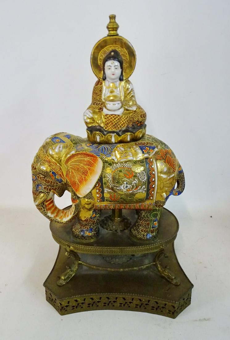 DECORATED PORCELAIN ELEPHANT & BUDDHA ON METAL STAND: DECORATED PORCELAIN ELEPHANT & BUDDHA ON METAL STAND (BUDDHA REPAIRED) 17"H 12"W
