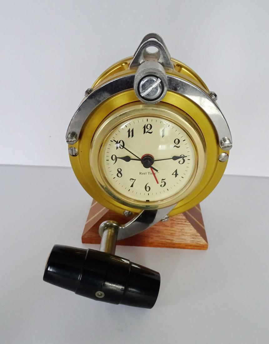 REAL TIME FISHING REEL CLOCK (BATTERY OPERATED) 5.5" X: REAL TIME FISHING REEL CLOCK (BATTERY OPERATED) 5.5" X 4" X 5"