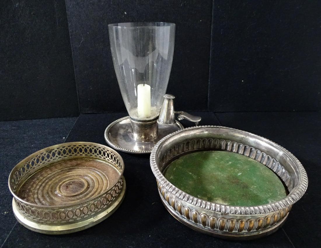 2 SILVER PLATE WINE COASTERS AND CHAMBERSTICK 2" X 5" DIA., 2" X 6.5" DIA., 7" X 6" DIA.: 2 SILVER PLATE WINE COASTERS AND CHAMBERSTICK 2" X 5" DIA., 2" X 6.5" DIA., 7" X 6" DIA.