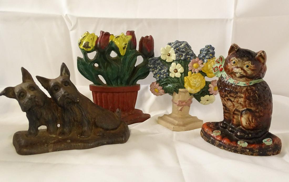 GROUP OF 4 CAST IRON DOOR STOPS [CAT] (1 of 10)