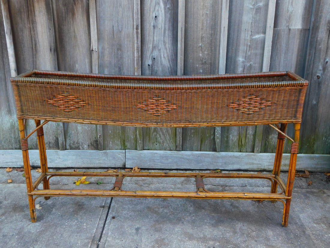 ESTATE OF SEYMOUR STEIN:WOVEN WICKER PLANTER 34" X 60" X 10 1/2" (1 of 15)