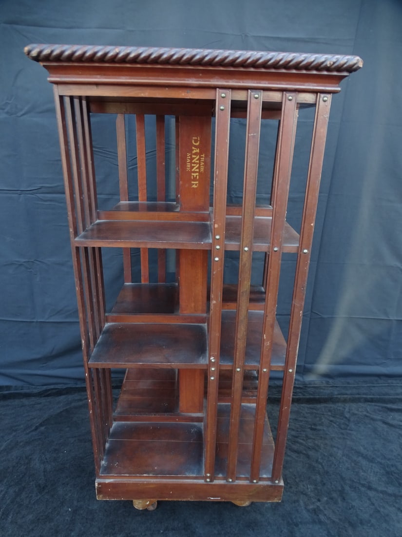ESTATE OF SEYMOUR STEIN: "DANNER" REVOLVING BOOK RACK ON STAND 45 1/2" X 21" X 20 1/2" (1 of 12)