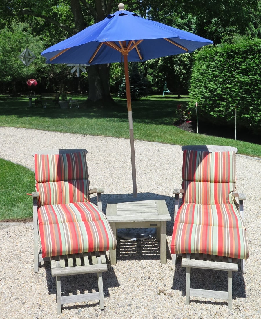 LIVING ESTATE OF JOSEPH RODANO: S. BARLOW AND TYRIE PAIR OF TEAK CHAISES, SMALL SQUARE TEAK TABLE,: LIVING ESTATE OF JOSEPH RODANO: S. BARLOW AND TYRIE PAIR OF TEAK CHAISES, SMALL SQUARE TEAK TABLE, UMBRELLA WITH STAND