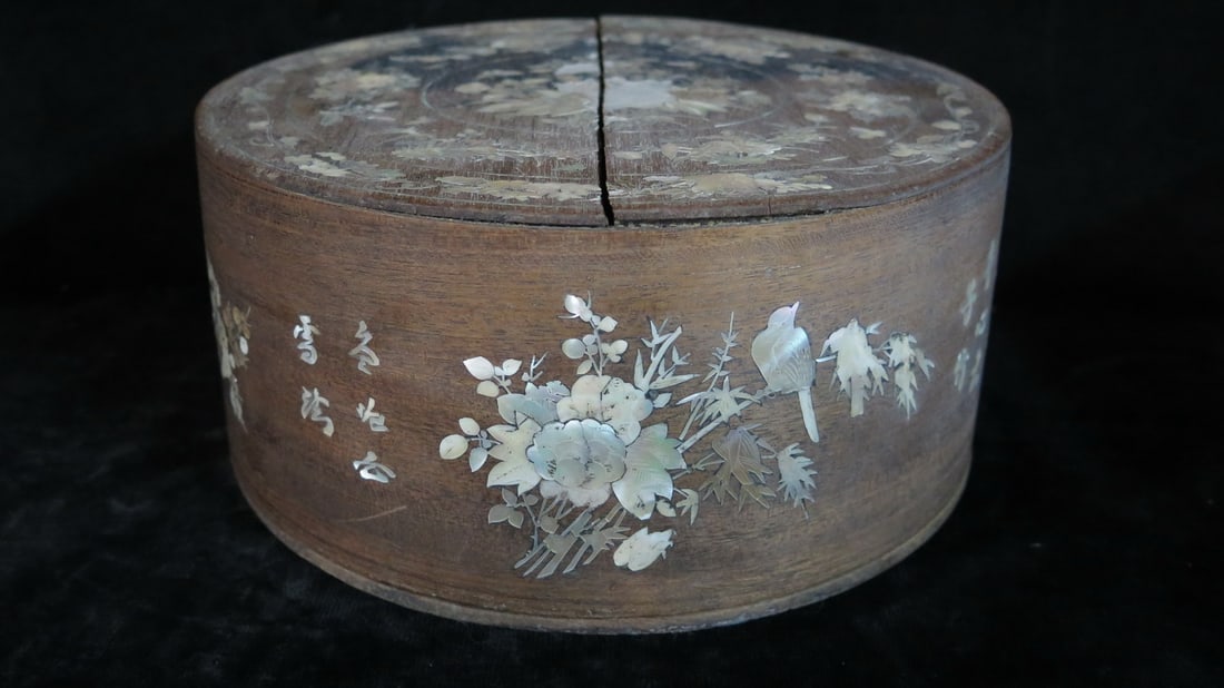 LIVING ESTATE OF JOSEPH RODANO: ASIAN SWEET BOX, MOTHER OF PEARL INLAY, 4.5 X 9.5" DIA.: Add a touch of exotic elegance to your home with this captivating Asian sweet box. Crafted from rich wood and adorned with stunning mother-of-pearl inlay, this box is as beautiful as it is functional.