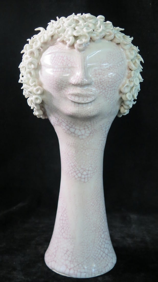 ESTATE OF DENNIS P. RODANO: PAUL BALLARDO PORCELAIN HEAD SCULPTURE 13 X 6.5 X 6.5 LOSSES NOTED ON: This captivating vintage art deco inspired porcelain head sculpture is a beautiful depiction of a woman with short, curly hair. The bust measures 13 inches tall by 6.5 inches wide and deep, making it 