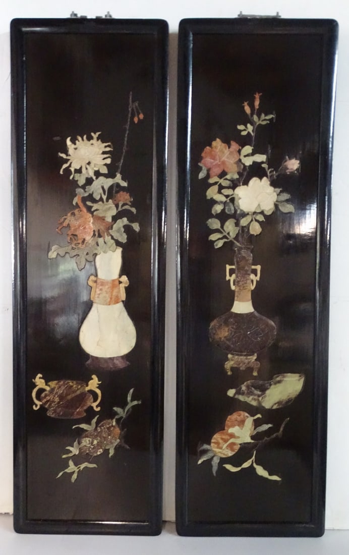 ESTATE OF DENNIS P. RODANO: PAIR OF ASIAN HARDSTONE PLAQUES: Elevate the décor of your home with this captivating pair of Asian hardstone plaques. These intricately carved plaques, likely made from jade or soapstone, depict a serene landscape scene with mounta