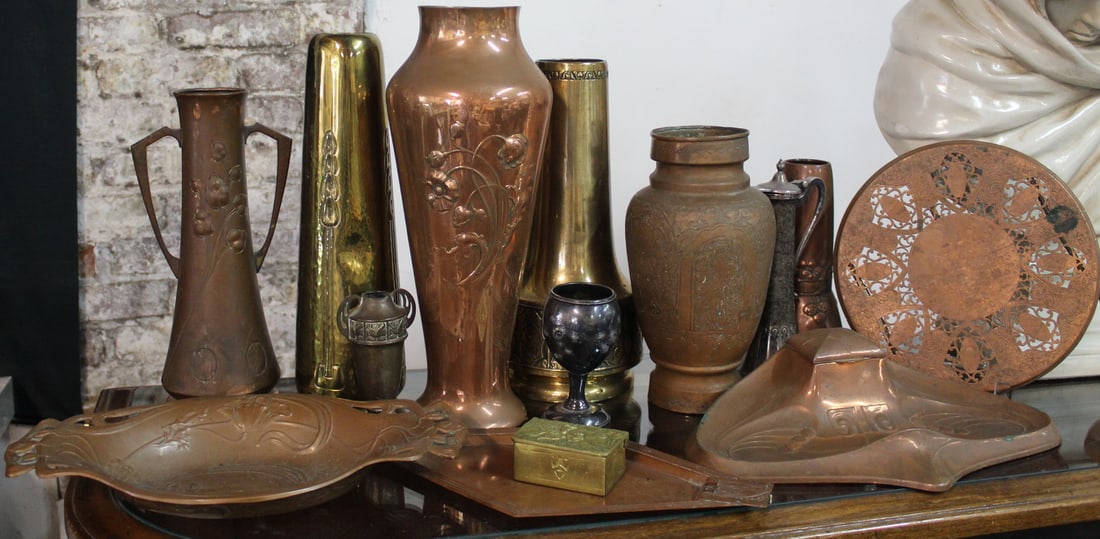 LARGE LOT OF ART NOUVEAU COPPER ITEMS INC..INKWELL, VASES AND TRIVET, 15.5 X 6.5 DIA. LARGEST: This a captivating collection of vintage copper items, including vases, bowls, and decorative objects, all crafted in the distinctive style of the Art Nouveau movement. These pieces are a testament to