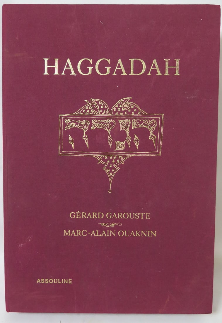 RARE HAGGADAH SPECIAL EDITION: PASSOVER SEDER CEREMONY GUIDE BY MARC-ALAIN OUKNIN: This exquisite Haggadah, a special edition of the Passover Seder ceremony guide by Marc-Alain Ouaknin, is a true collector's item. Bound in a rich burgundy cloth with gold lettering, the book features