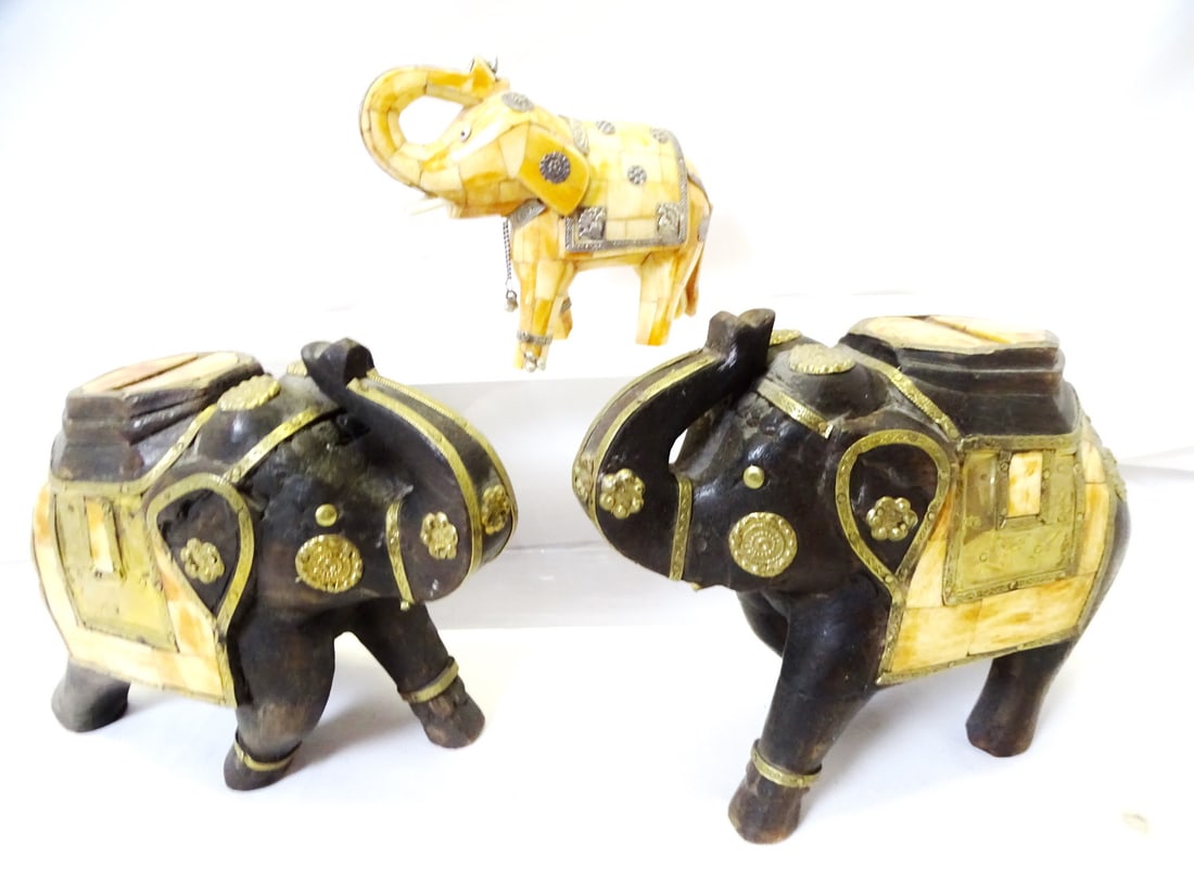 COLLECTION OF THREE TESSELATED BONE ELEPHANTS: A trio of tessellated bone elephants, each measuring 6 inches by 7 inches, offers a unique and elegant addition to any interior space. The intricate mosaic patterns, created from small pieces of bone,