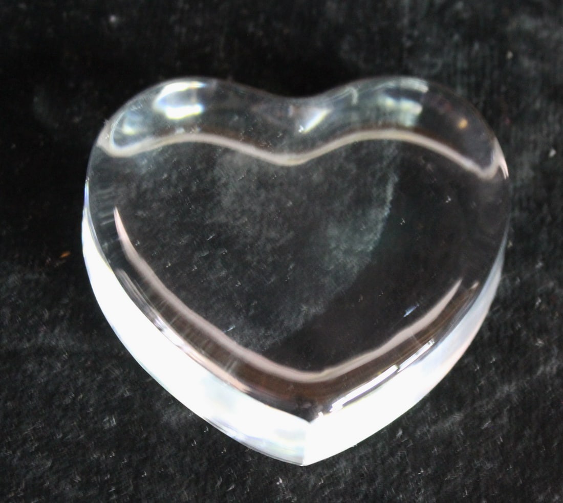 CURATED COLLECTION OF JOSEPH RODANO: TIFFANY & CO CRYSTAL HEART: This Tiffany & Co Crystal Heart is a timeless and elegant piece that will add a touch of luxury to any space. This exquisite heart-shaped paperweight is crafted from high-quality crystal, showcasing t