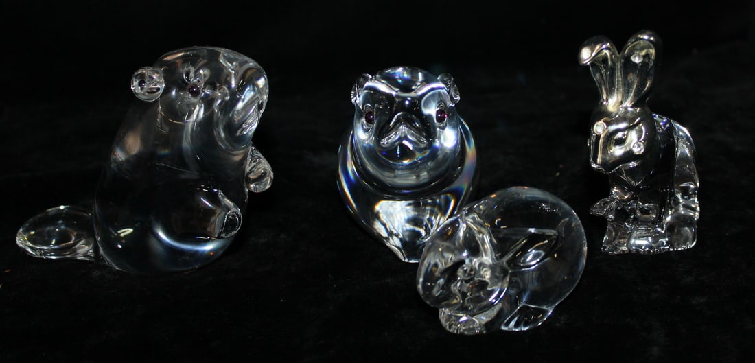 CURATED COLLECTION OF JOSEPH RODANO: FOUR CRYSTAL ANIMALS, TWO BUNNIES, TWO BEAVERS: This charming collection of crystal animals features four adorable creatures: two bunnies and two beavers. The bunnies are depicted in playful poses, while the beavers stand tall and proud. One of the