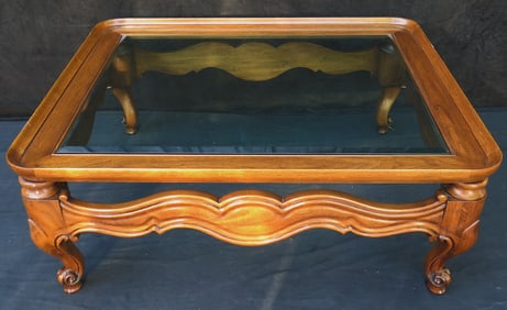 ESTATE OF DENNIS P. RODANO SR.: FRUITWOOD GLASS TOP COFFEE TABLE