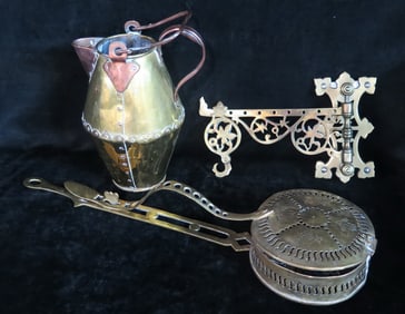 THREE PIECE BRASS LOT INC.. 19C CHESTNUT WARMER, ORNATE BRACKET, AND BRASS AND COPPER PITCHER