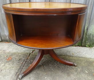 MAHOGANY LEATHER TOPPED REVOLVING DRUM TABLE