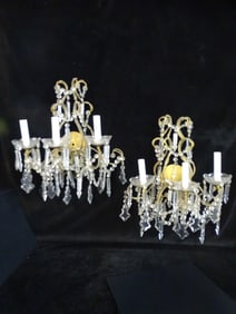 PAIR OF SKELETON-FORM THREE LIGHT SCONCES WITH CRYSTAL BOBECHES