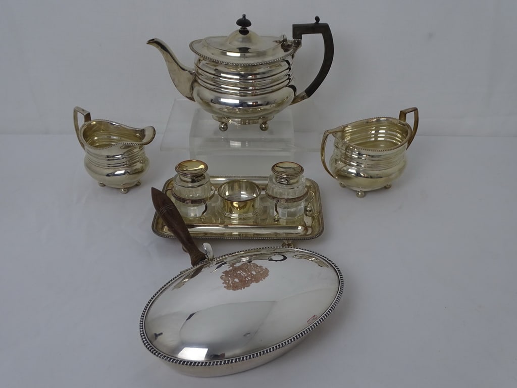 COLLECTION OF STERLING SILVER, WEIGHT OF GRAVY BOAT: 5.18 OZ.: This collection of sterling silver pieces showcases the beauty and craftsmanship of this precious metal. The Italian salt and pepper shakers, with their intricate detailing and elegant design, are a s