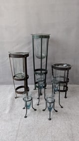 LIVING ESTATE OF JOSEPH RODANO: COLLECTION OF 7 WROUGHT IRON STANDS AND BLOWN GLASS CONTAINERS