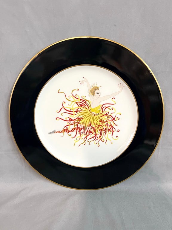LIVING ESTATE OF JOSEPH RODANO: VINTAGE ERTE MIKASA "APPLAUSE" ART DECO PLATTER: This vintage Erte platter is a stunning example of the renowned artist's unique style. Erte, known for his Art Deco designs, often incorporated bold colors, geometric shapes, and stylized figures into