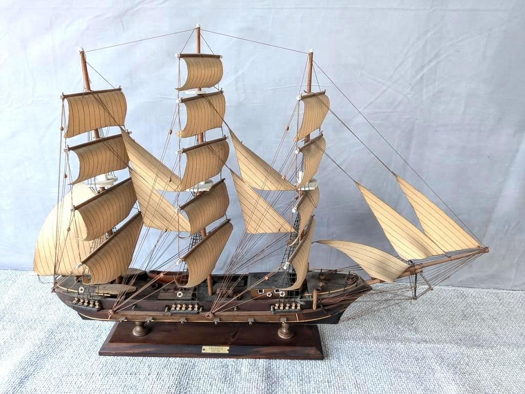 VINTAGE MODEL OF 18TH CENTURY SPANISH WARSHIP FRAGATA / FRIGATE: This vintage model of the 18th-century Spanish warship marked "Fragata Siglio XVIII" is a stunning piece of nautical craftsmanship. The intricate details, from the carved wooden hull to the meticulous