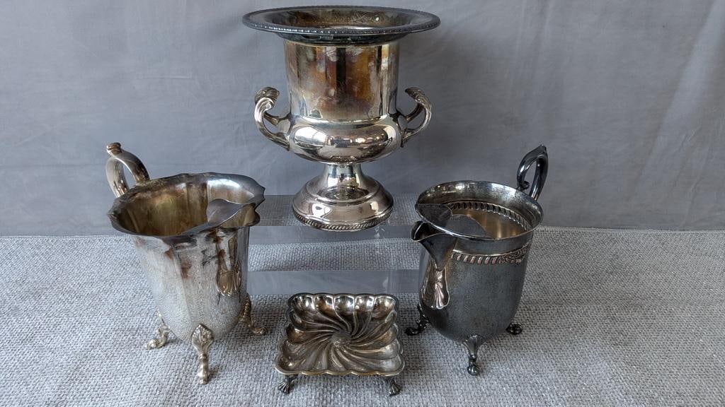 LIVING ESTATE OF JOSEPH RODANO: LOT OF FOUR ENGLISH SILVERPLATE: This silver collection of silver-plated pieces by F.B. Rogers showcases the company's renowned craftsmanship and elegant design. Whimsical Pitchers: These charming pitchers, with their distinctive lea