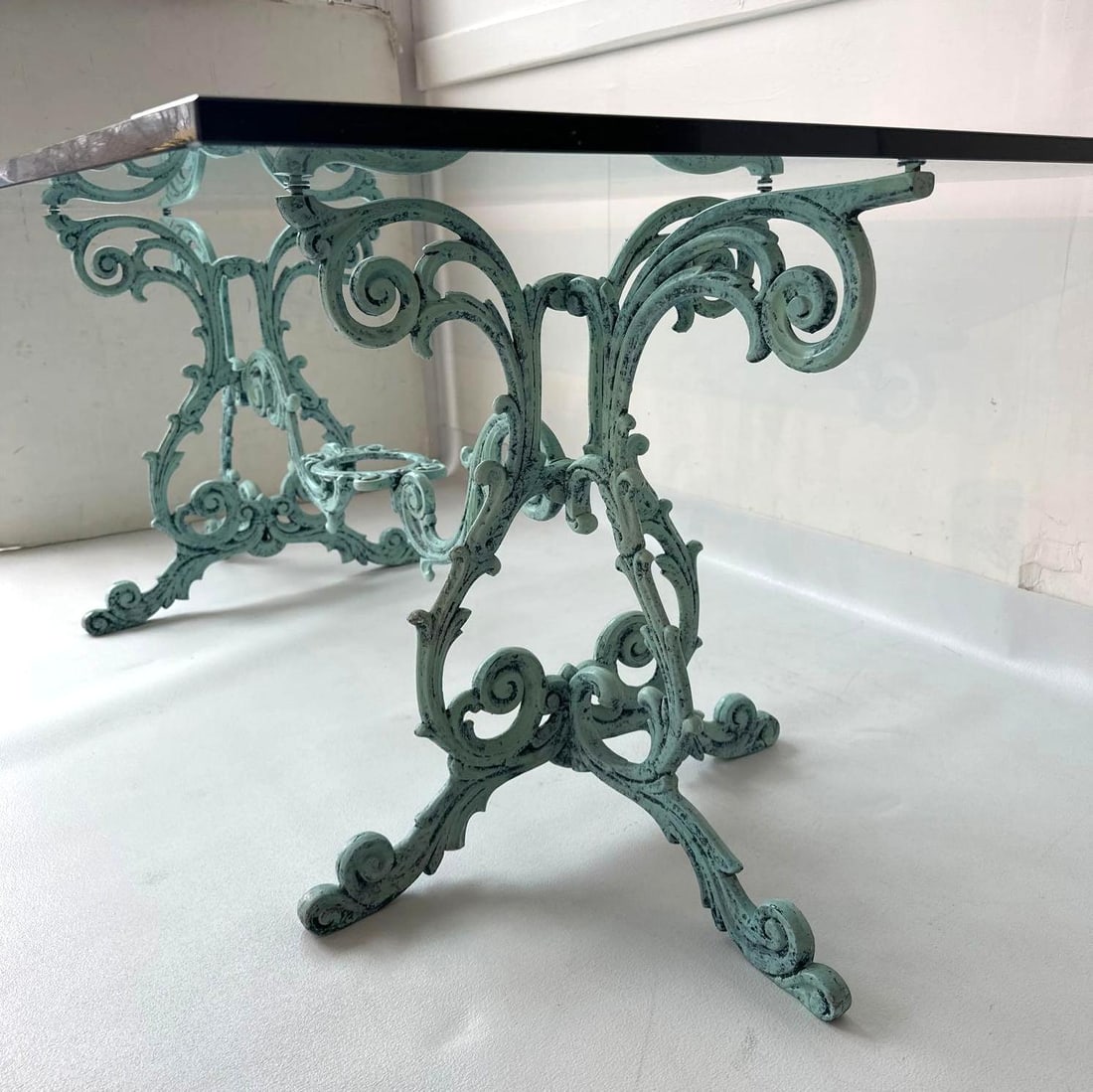 ELEGANT GLASS DINING TABLE WITH ORNATE CAST IRON BASE | PURPORTEDLY VANDERBILT ESTATE (1 of 9)