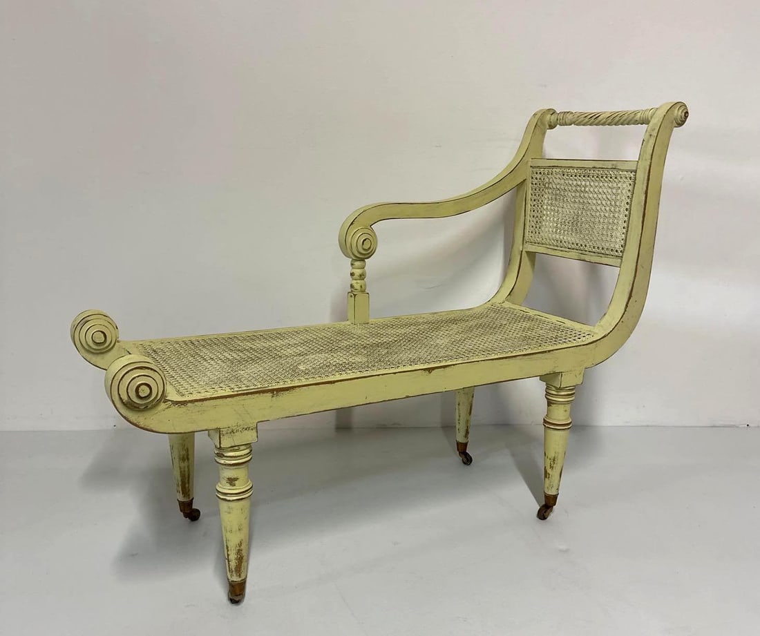 VINTAGE REGENCY STYLE CANED CHAISE LOUNGE | DAYBED: This elegant vintage daybed exudes the charm of the Regency era with its graceful lines and delicate details. The frame, likely crafted from mahogany or a similar hardwood, showcases the characteristi