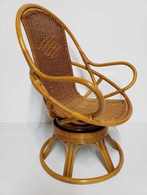 MID-CENTURY SCULPTURAL RATTAN ROCKER