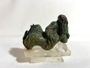 VINTAGE RECLINING GREEEN HARDSTONE CARVED BUDDAH ON A ROCK CRYSTAL BASE