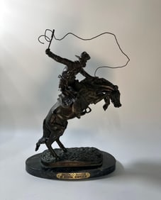 BRONZE "BRONCO BUSTER" SCULPTURE AFTER FREDERIC REMINGTON